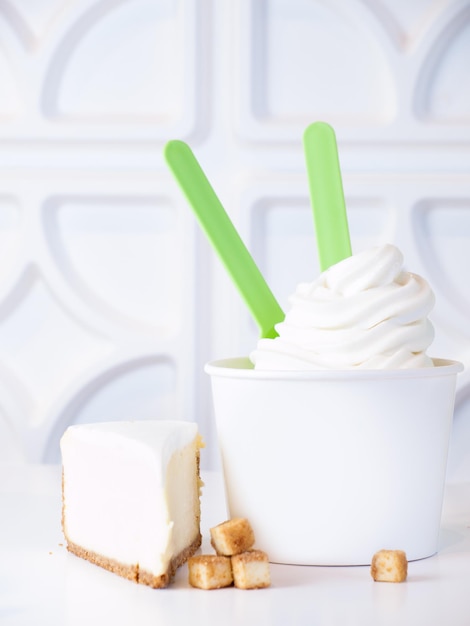 Cup of cheesecake frozen yogurt or soft serve ice cream.