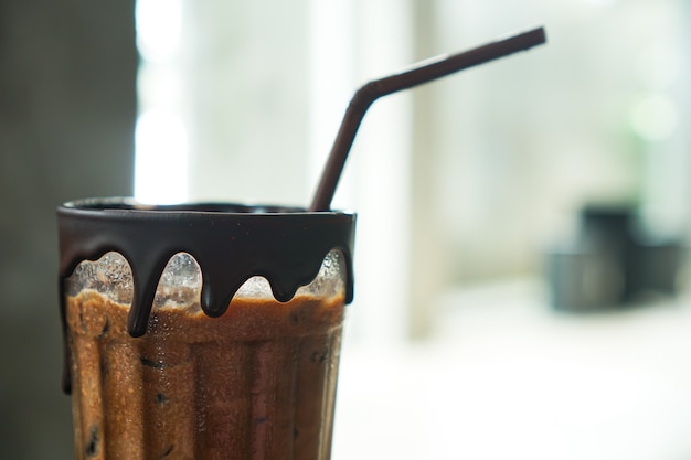 Cup of chocolate on wooden plate