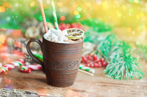 Cup of cocoa on a festive background Cocoa in brown clay cup close