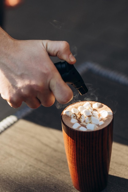 A cup of cocoa with marshmallows