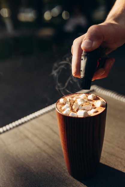 A cup of cocoa with marshmallows