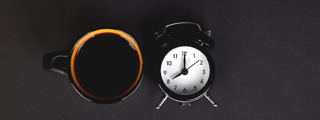 Cup of coffee and an alarm clock