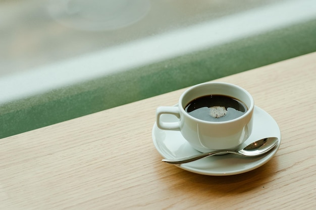 Cup of coffee background in the morning sunlight