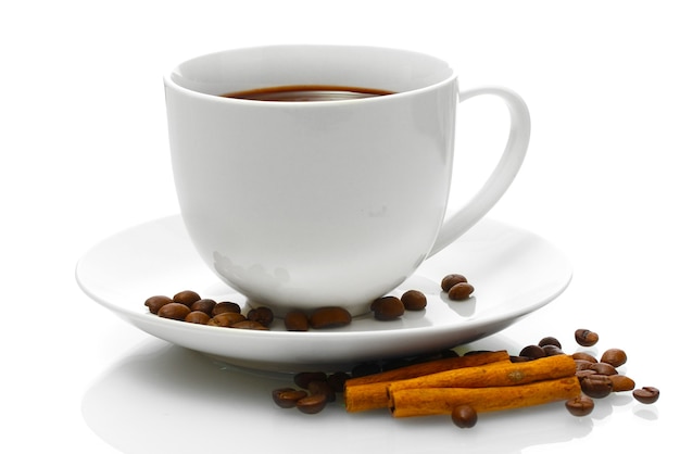 Cup of coffee, beans and cinnamon sticks isolated on white
