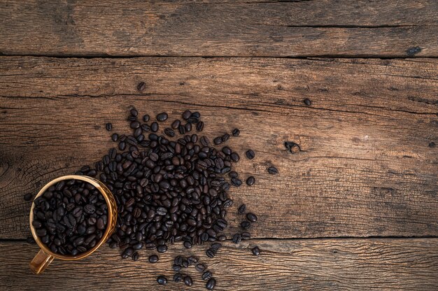 Cup of coffee beans on the desk top view