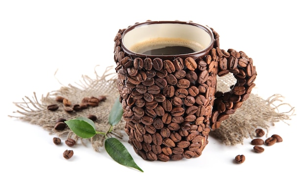 Cup of coffee beans isolated on white