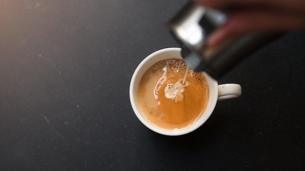 cup of coffee on black table in cafe