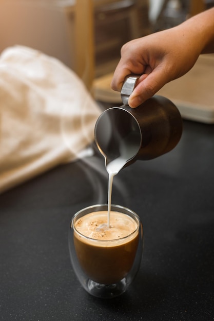 cup of coffee on black table in cafe