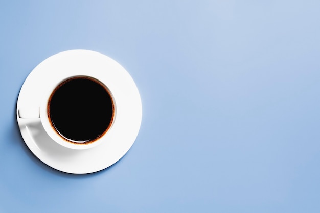 Cup of coffee on a blue background