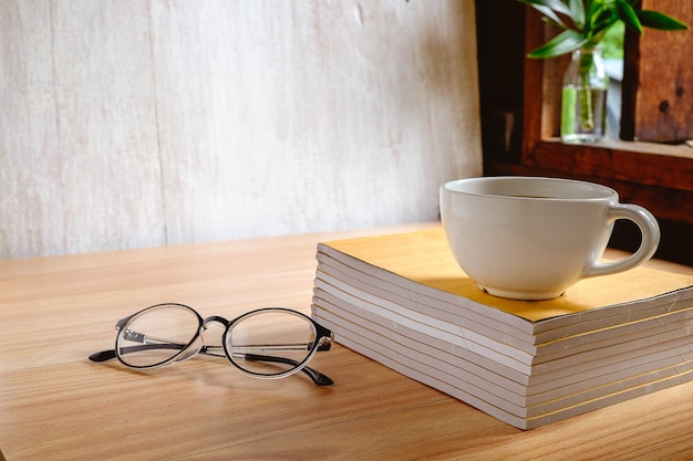 Cup of coffee on book