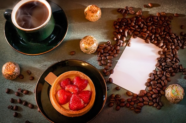 Cup of coffee and cake with strawberries