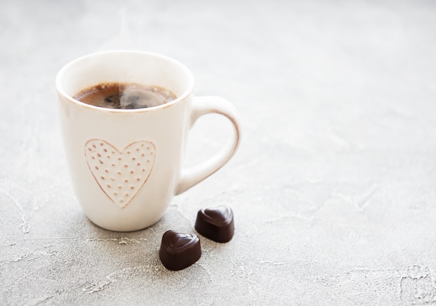 Cup of coffee and chocolate candy