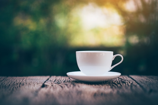 A cup of coffee and coffee beans on the table of coffee lovers coffee.