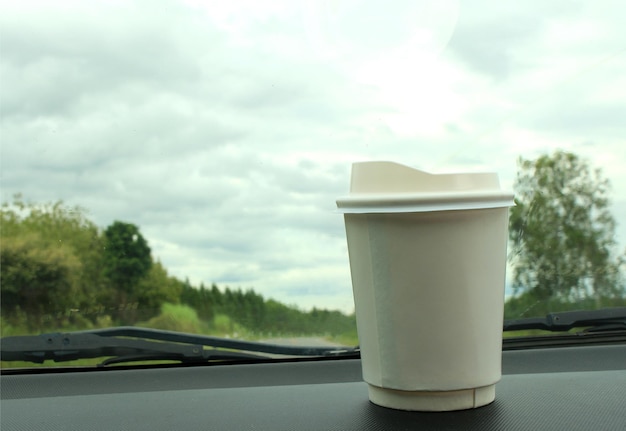 A cup of coffee on the console car