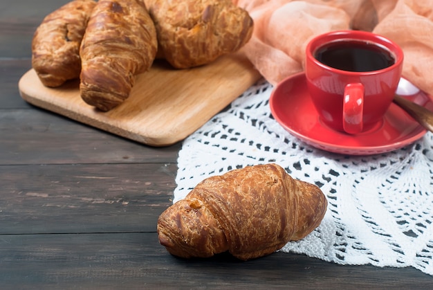 Cup of coffee and croissants