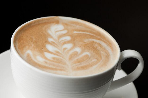 Cup of coffee on a dark background