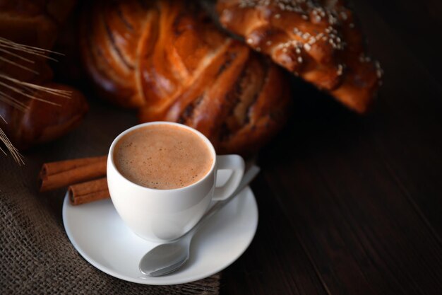 Cup of coffee and different bakery products