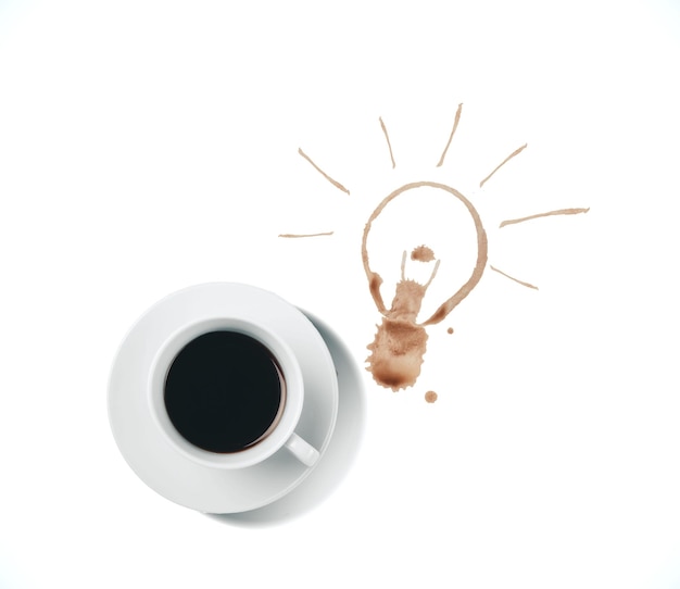 Cup of coffee and drawing light bulb