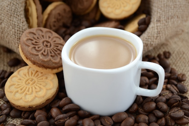 A cup of coffee in the early morning with shortbread. Close-up.