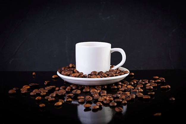 Cup of coffee espresso. Hot drink coffee on dark background