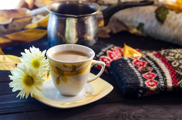 Cup of coffee on a fall day