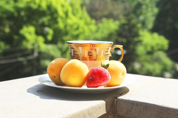 cup of coffee and fruit