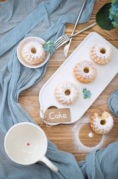 A cup of coffee and handmade muffins Baking with sugar