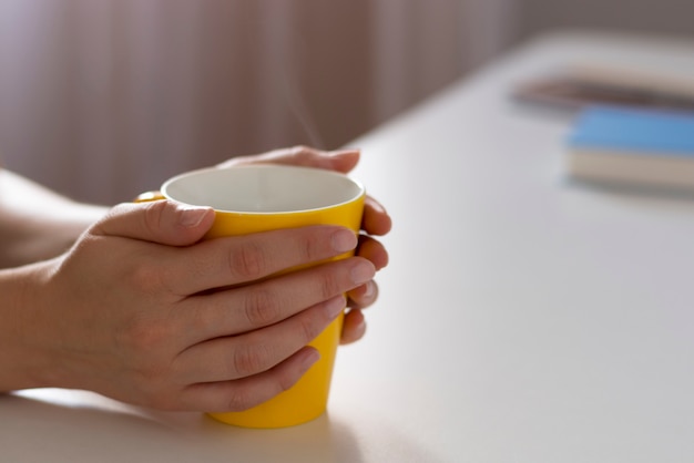 Cup of coffee in hands