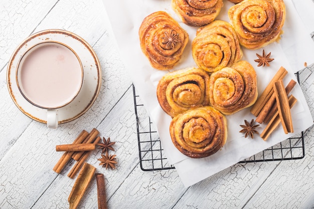 Cup of coffee and homemade cinnamon buns