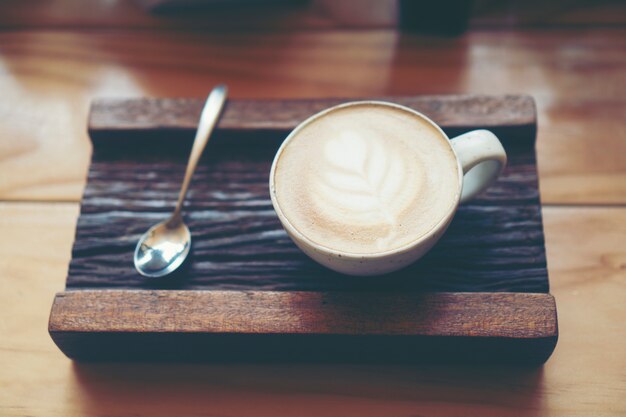 Cup of coffee latte in coffee shop