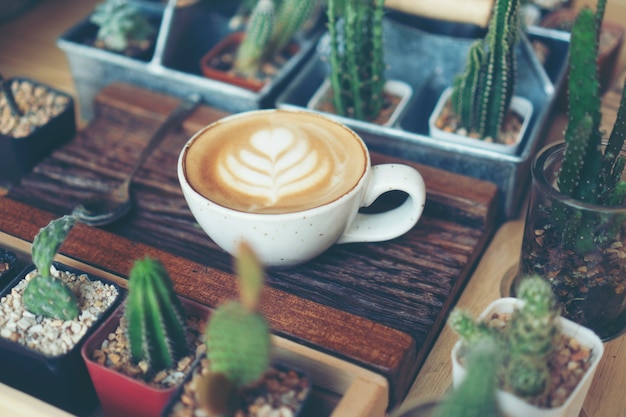 Cup of coffee latte in coffee shop