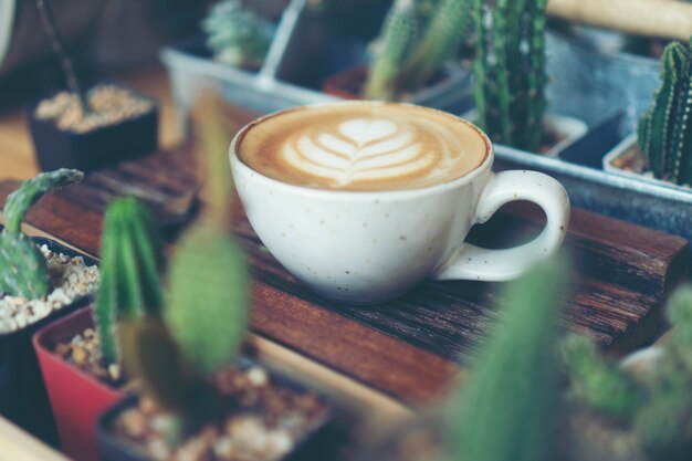 Cup of coffee latte in coffee shop