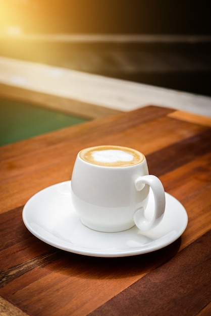 Cup of coffee latte on wood table