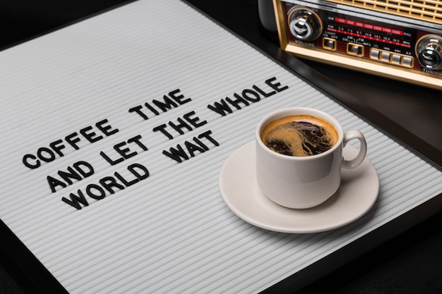 Cup of coffee on a letter board