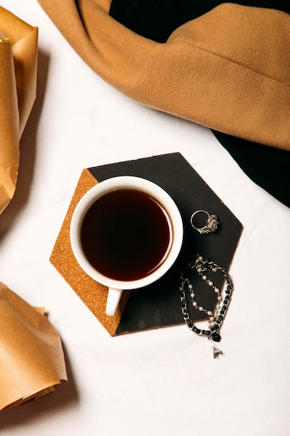 a cup of coffee on a light background