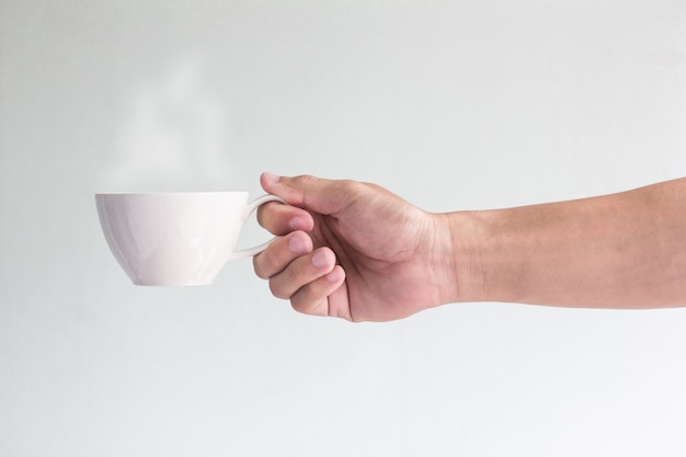 Photo cup of coffee in man hand