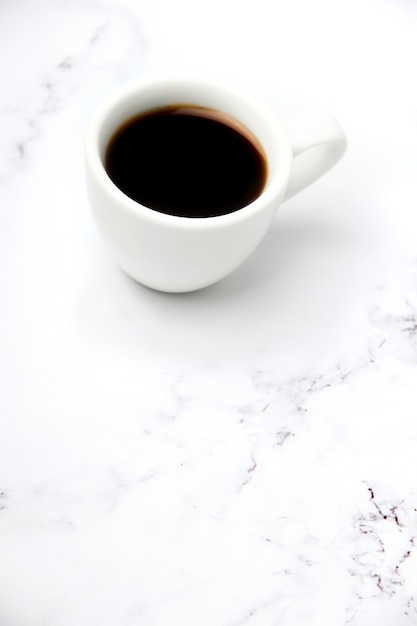 Cup of coffee on a marble table