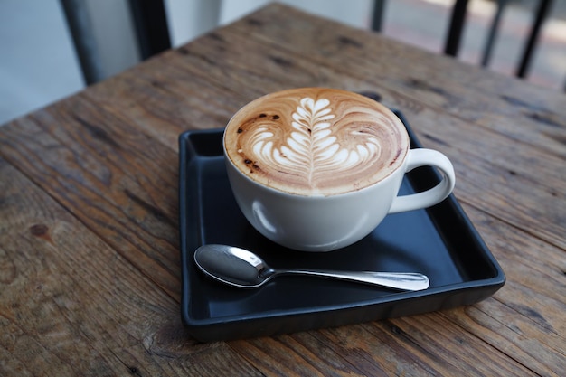 A cup of coffee mocha on wooden