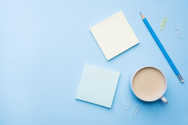 Cup of coffee and notepad  with flat lay