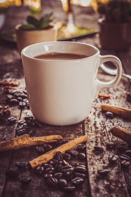 cup of coffee on old wooden desk. 