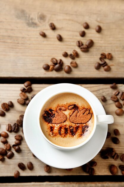 Cup of coffee on old wooden table