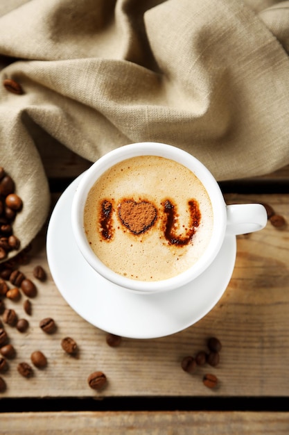 Cup of coffee on old wooden table