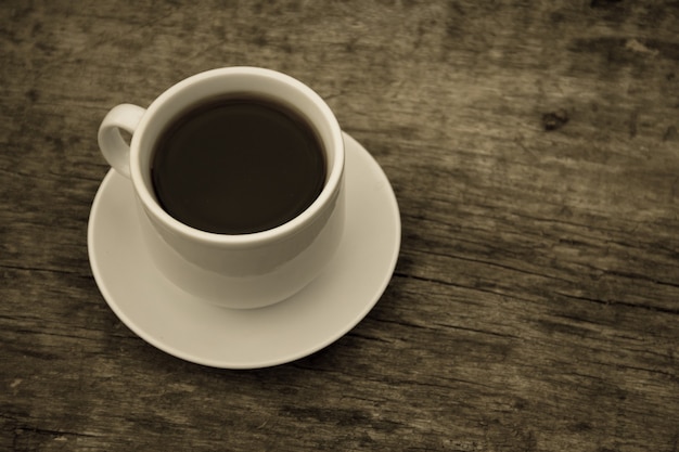 Cup of coffee on rustic wooden table