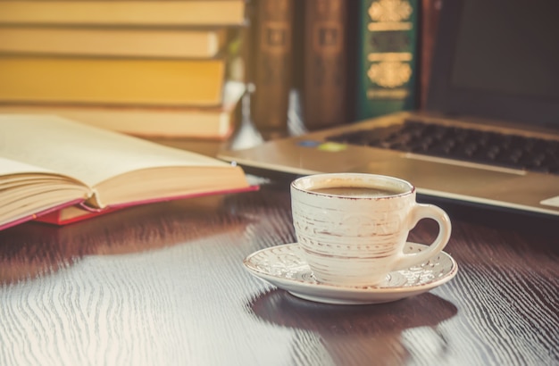 A cup of coffee and a smoke good morning at the office at work. Selective focus.