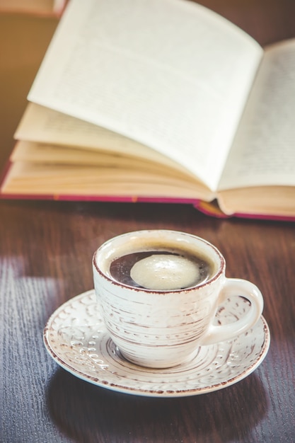 A cup of coffee and a smoke good morning at the office at work. Selective focus.