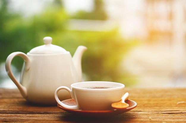 Cup of coffee on table in Morning light