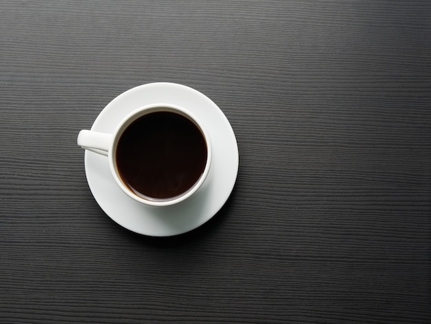 Cup of coffee on the table with copy space. Top view.