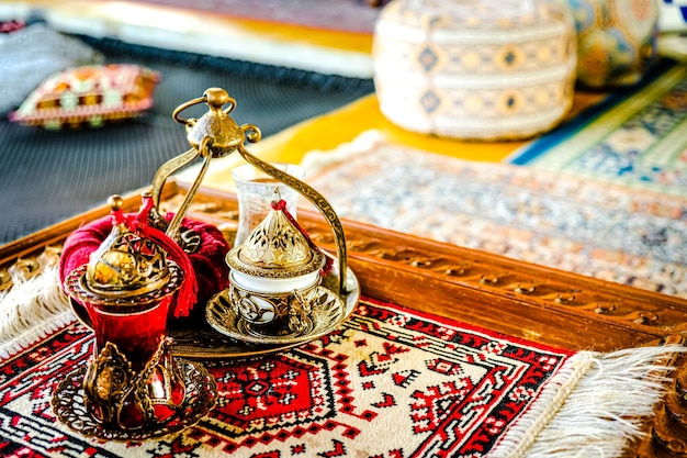 A cup of coffee on the traditional turkish tablecloth with honey and baklava