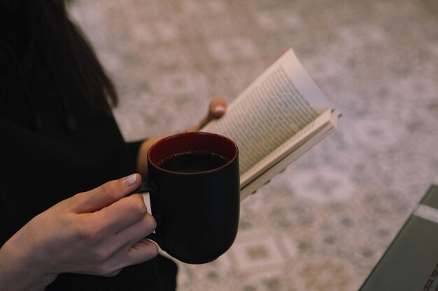 A cup of coffee while reading a book or magazine