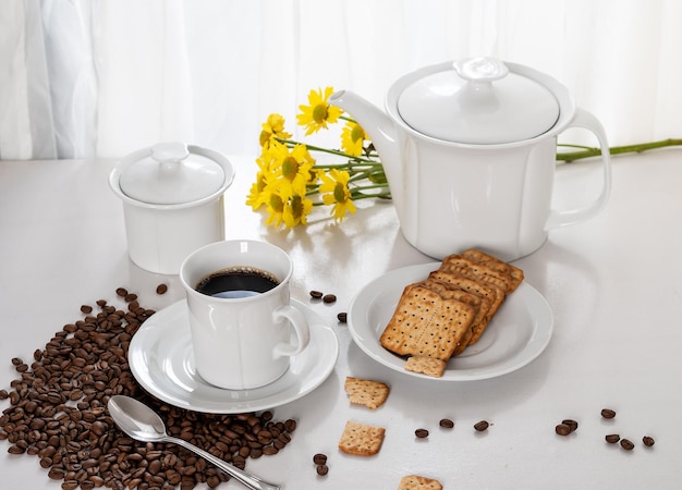 cup of coffee, wholegrain cookies on a saucer, on a table by the window, ligh